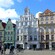 A pedestrian street lined with multistory, gabled buildings